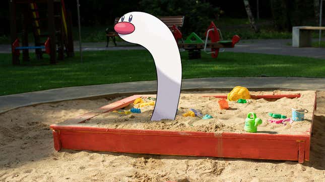 An image shows a cartoon Wiglett hanging out in a sandbox. 