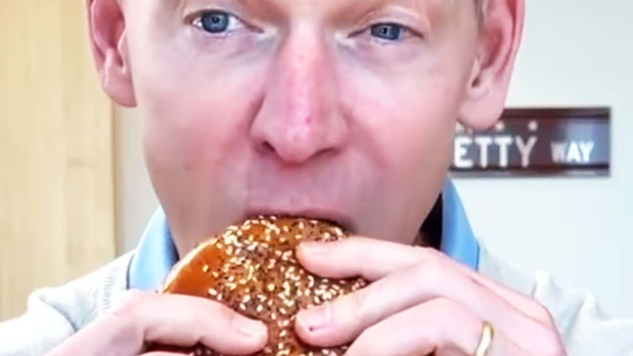 McDonald’s Chief Executive Encounters Difficulties While Sampling the New Big Arch Burger in Popular Video